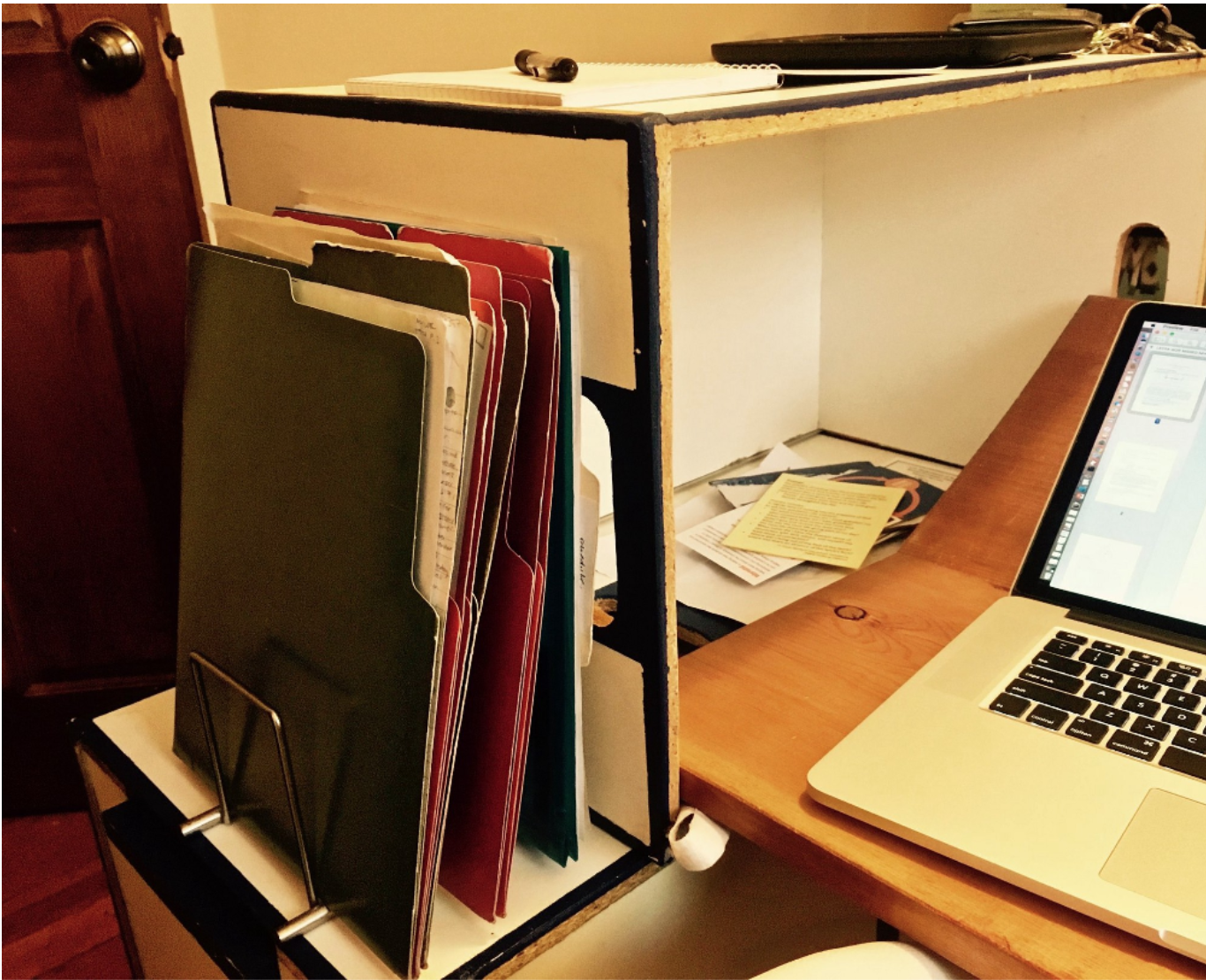 closeup of desk showing ledge to place standing folders on